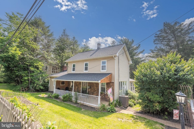 1501 Long Corner Rd, Mount Airy, MD 21771 - view of front of home with central AC unit, a front yard, covered porch, a chimney, and stone siding
