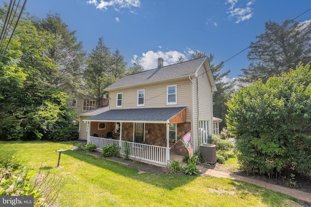1501 Long Corner Rd, Mount Airy, MD 21771 - view of front of home with a porch, a front yard, a chimney, stone siding, and cooling unit