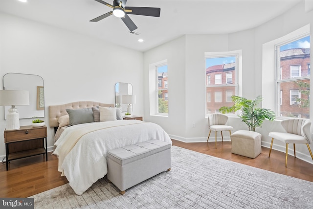 bedroom featuring baseboards, recessed lighting, a ceiling fan, and wood finished floors