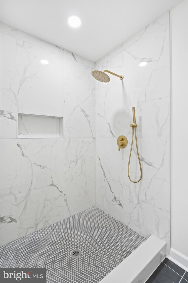 bathroom with walk in shower and recessed lighting