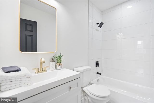 full bath featuring toilet, vanity, and shower / washtub combination