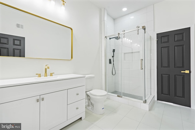 bathroom featuring vanity, toilet, visible vents, and a shower stall