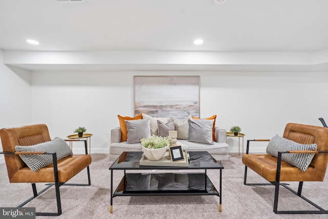 living area featuring carpet floors, baseboards, and recessed lighting