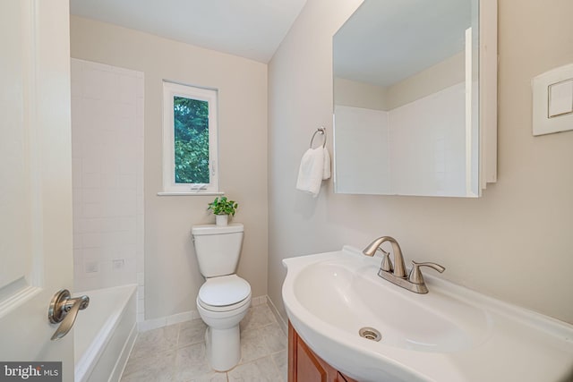 bathroom featuring toilet, vanity, tile patterned floors, and baseboards