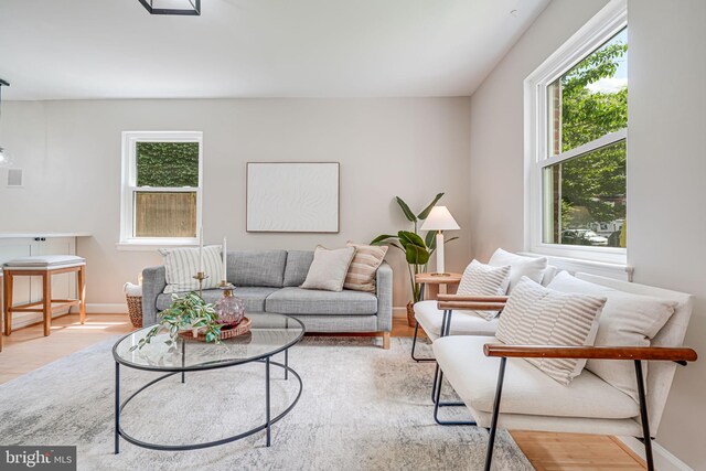 living room with light wood-style floors and baseboards