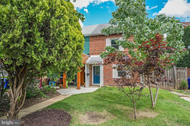 view of front of property featuring brick siding
