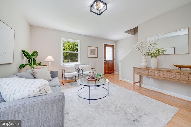 living room featuring wood finished floors and baseboards