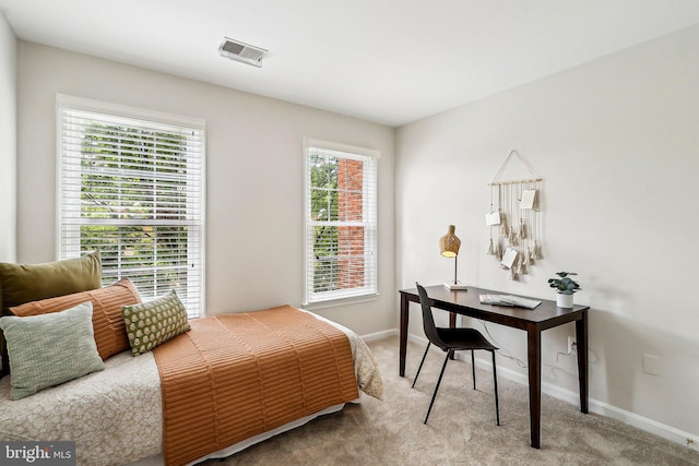 bedroom with carpet flooring and baseboards
