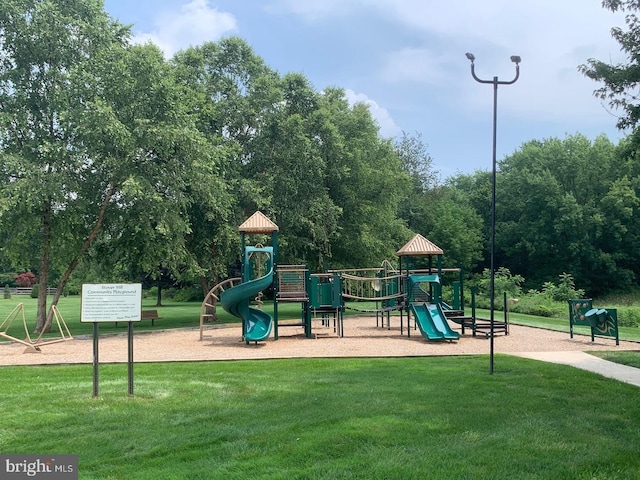 community jungle gym with a lawn