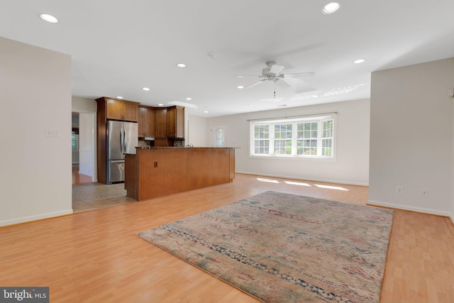 1711 Tedbury St, Crofton, MD 21114 - kitchen with freestanding refrigerator, open floor plan, recessed lighting, ceiling fan, and baseboards