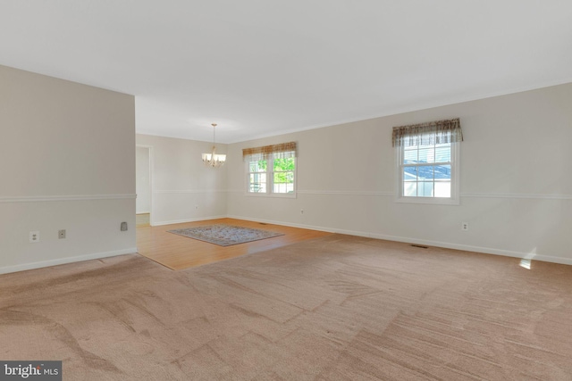 1711 Tedbury St, Crofton, MD 21114 - spare room with a chandelier, carpet floors, and baseboards