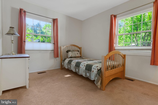 1711 Tedbury St, Crofton, MD 21114 - carpeted bedroom featuring multiple windows and baseboards