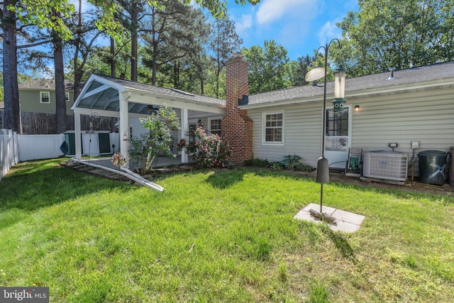 1711 Tedbury St, Crofton, MD 21114 - rear view of property featuring central air condition unit, a chimney, and a sunroom
