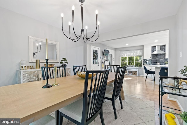 15807 Marlington Dr, Dumfries, VA 22025 - dining area featuring light wood-type flooring and a chandelier