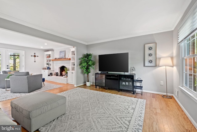 15807 Marlington Dr, Dumfries, VA 22025 - living area featuring a fireplace, ornamental molding, plenty of natural light, and wood finished floors
