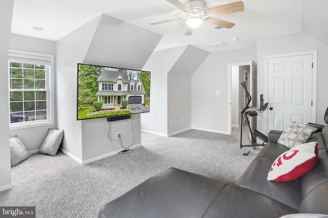 exercise room featuring ceiling fan, lofted ceiling, carpet, and baseboards