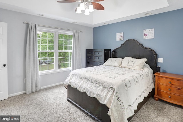 bedroom featuring baseboards, a ceiling fan, and carpet