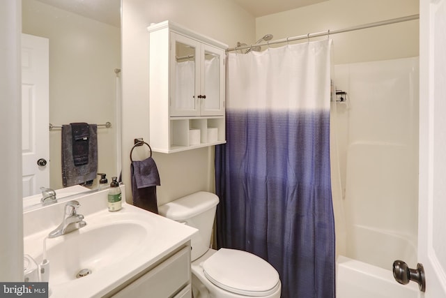 bathroom with toilet, shower / tub combo with curtain, and vanity