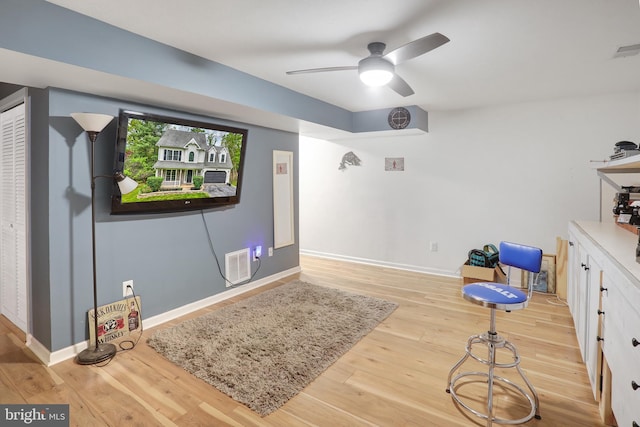 game room featuring a ceiling fan, baseboards, visible vents, and wood finished floors