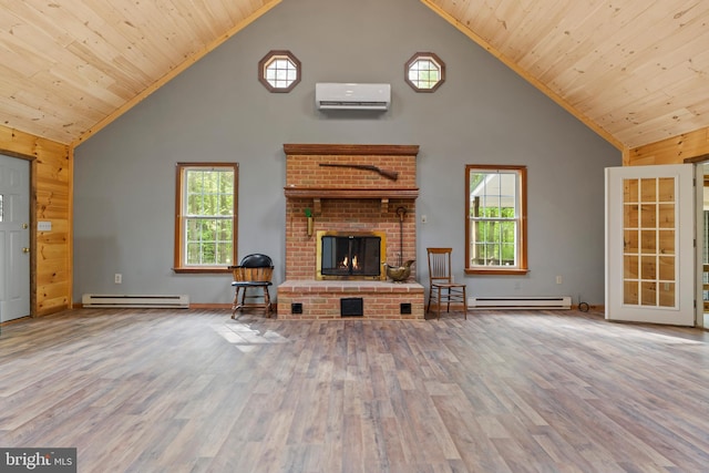 unfurnished living room featuring high vaulted ceiling, an AC wall unit, baseboard heating, wood finished floors, and a fireplace