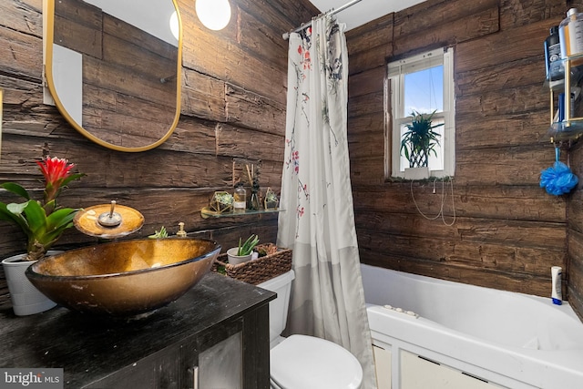 bathroom featuring vanity, toilet, and shower / bath combination with curtain