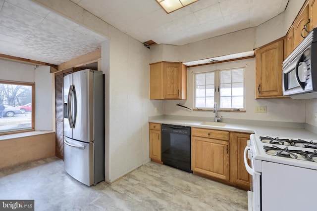 10 E Canal Rd, York, PA 17404 - kitchen featuring light countertops, stainless steel appliances, brown cabinets, and a sink