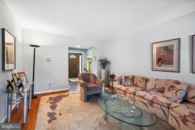 living room with wood finished floors and baseboards