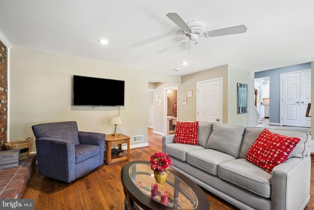 living room with wood finished floors, ceiling fan, baseboards, and recessed lighting