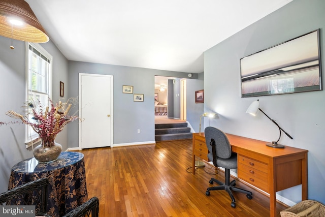 office with hardwood / wood-style floors and baseboards