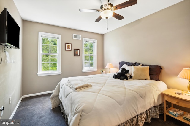 carpeted bedroom with baseboards and ceiling fan