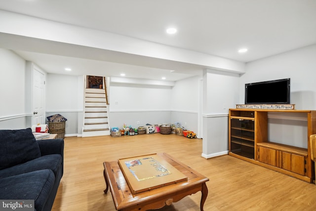living room with wood finished floors, stairway, wine cooler, and recessed lighting