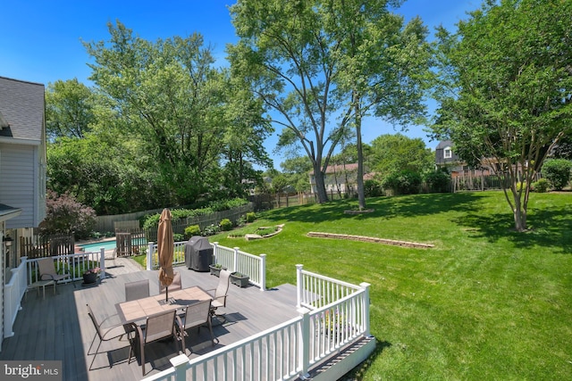 wooden deck featuring outdoor dining space