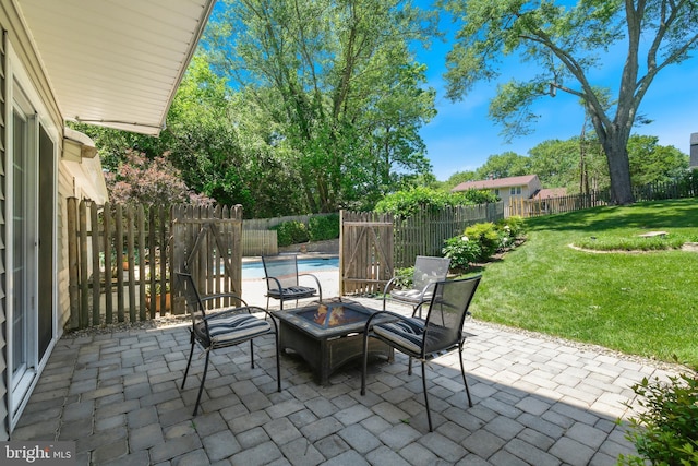 view of patio / terrace with an outdoor fire pit