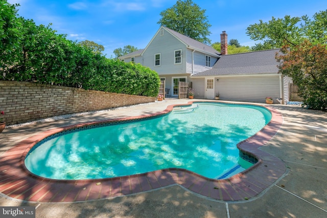 swimming pool featuring a patio