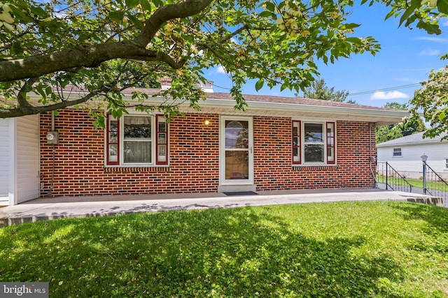 single story home with brick siding