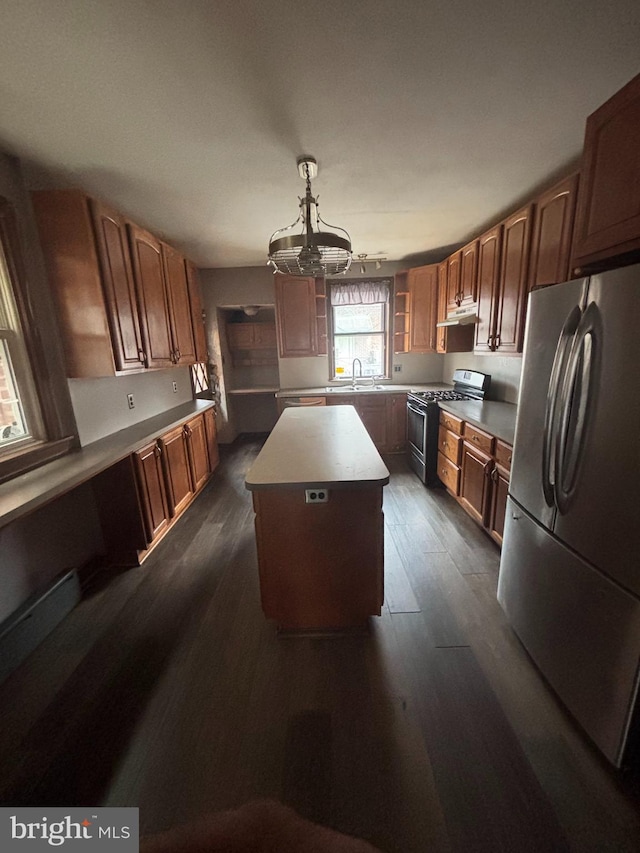 3313 Saint Vincent St, Philadelphia, PA 19149 - kitchen featuring a sink, stainless steel appliances, dark wood finished floors, an inviting chandelier, and a kitchen island