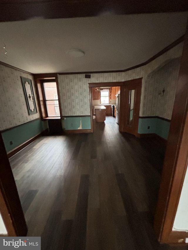 3313 Saint Vincent St, Philadelphia, PA 19149 - unfurnished living room with baseboards, dark wood-style flooring, wallpapered walls, and plenty of natural light