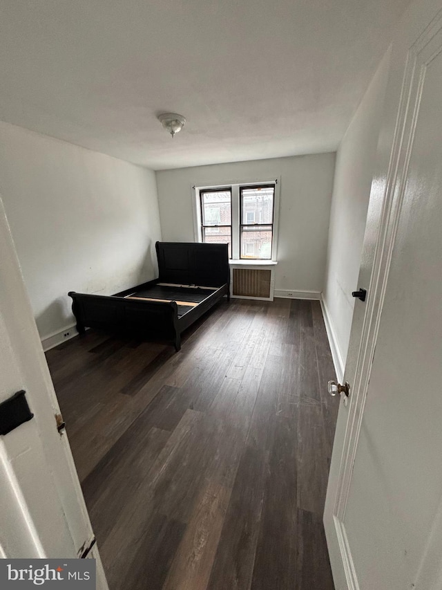 3313 Saint Vincent St, Philadelphia, PA 19149 - unfurnished bedroom featuring radiator and wood finished floors