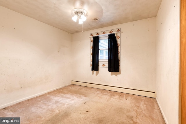 407 Stately Dr, Pasadena, MD 21122 - carpeted spare room featuring a baseboard heating unit, baseboards, and a ceiling fan