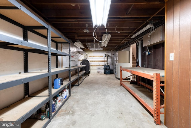 407 Stately Dr, Pasadena, MD 21122 - unfinished basement with a workshop area, oil tank, and heating unit