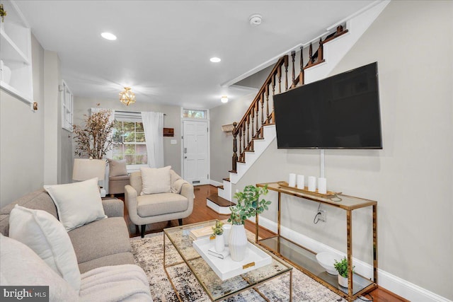living room with baseboards, stairway, recessed lighting, and wood finished floors