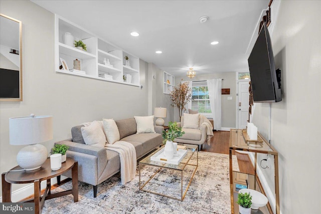 living room with wood finished floors and recessed lighting