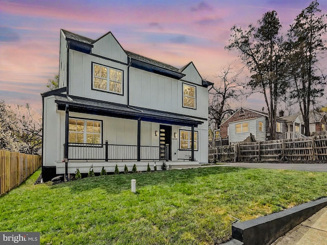 6604 Gude Ave, Takoma Park, MD 20912 - back of property at dusk featuring a porch and board and batten siding