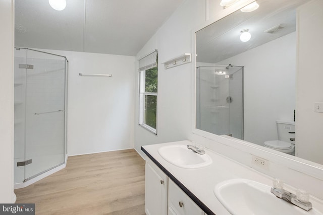 61 Brent Point Rd, Stafford, VA 22554 - full bathroom featuring a stall shower, wood finished floors, double vanity, and toilet