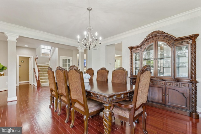 40999 Waxwing Dr, Leesburg, VA 20175 - dining space with stairs, a chandelier, dark wood finished floors, ornamental molding, and baseboards
