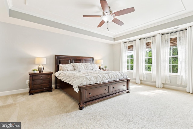 40999 Waxwing Dr, Leesburg, VA 20175 - bedroom featuring a tray ceiling, light carpet, crown molding, baseboards, and ceiling fan