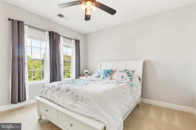 40999 Waxwing Dr, Leesburg, VA 20175 - bedroom with light colored carpet, baseboards, and a ceiling fan