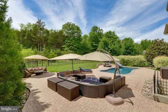 40999 Waxwing Dr, Leesburg, VA 20175 - view of swimming pool featuring an outdoor living space, a patio, and fence