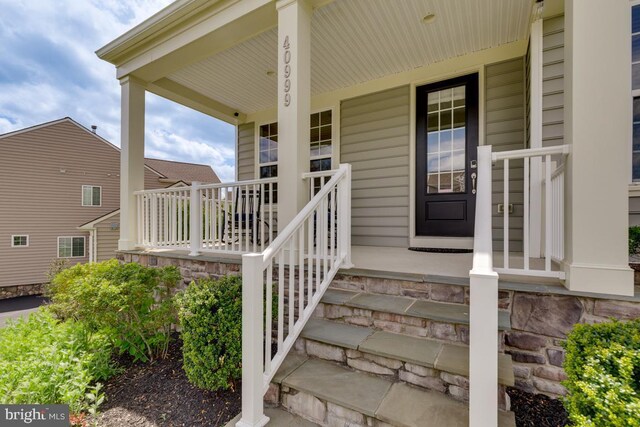 40999 Waxwing Dr, Leesburg, VA 20175 - doorway to property with a porch