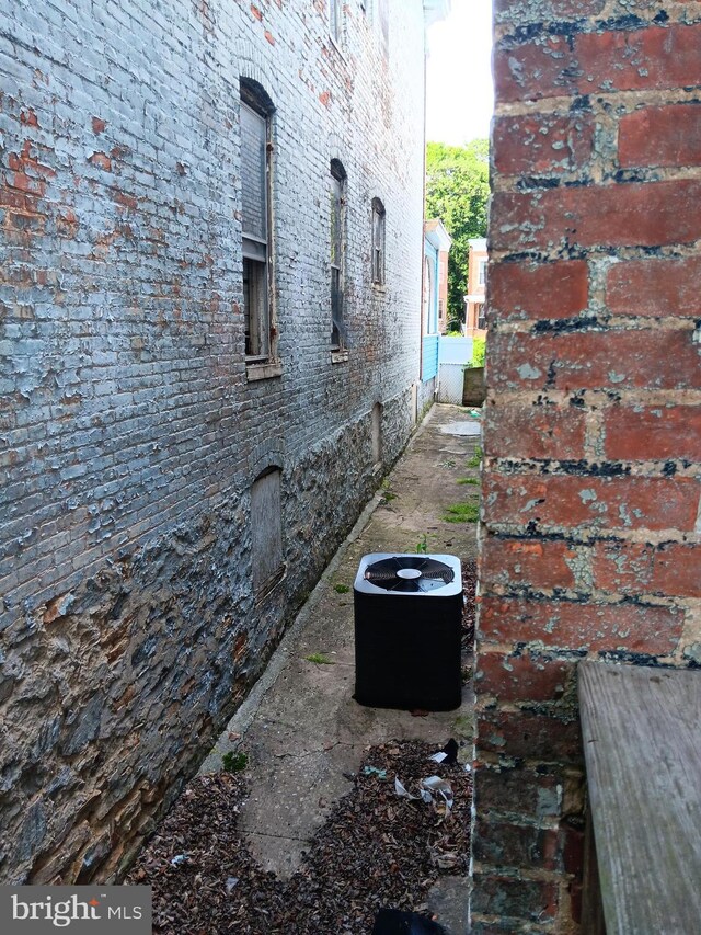view of property exterior with brick siding